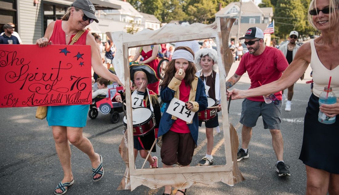 Children recreate Archibald Willard's 'The Spirit of '76' inside a handmade frame during the Fourth of July horribles parade.