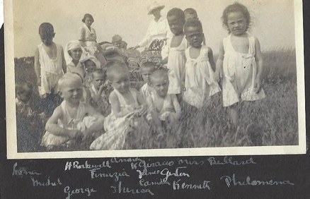 A historical photograph of children at the Children's Island Sanitarium with handwritten captions.