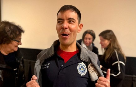 Niko Kuzmina grinning in a Marblehead Police polo at his sendoff.