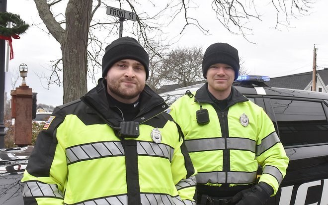 Two patrolmen in high-visibility jackets on Christmas Walk detail.