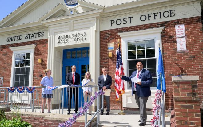 Officials gather outside the Marblehead post office for a proclamation.